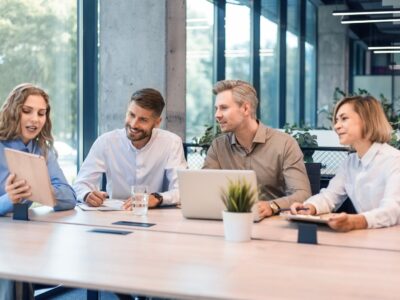 Happy,Four,Business,People,Executive,Team,Working,At,Laptop,Having